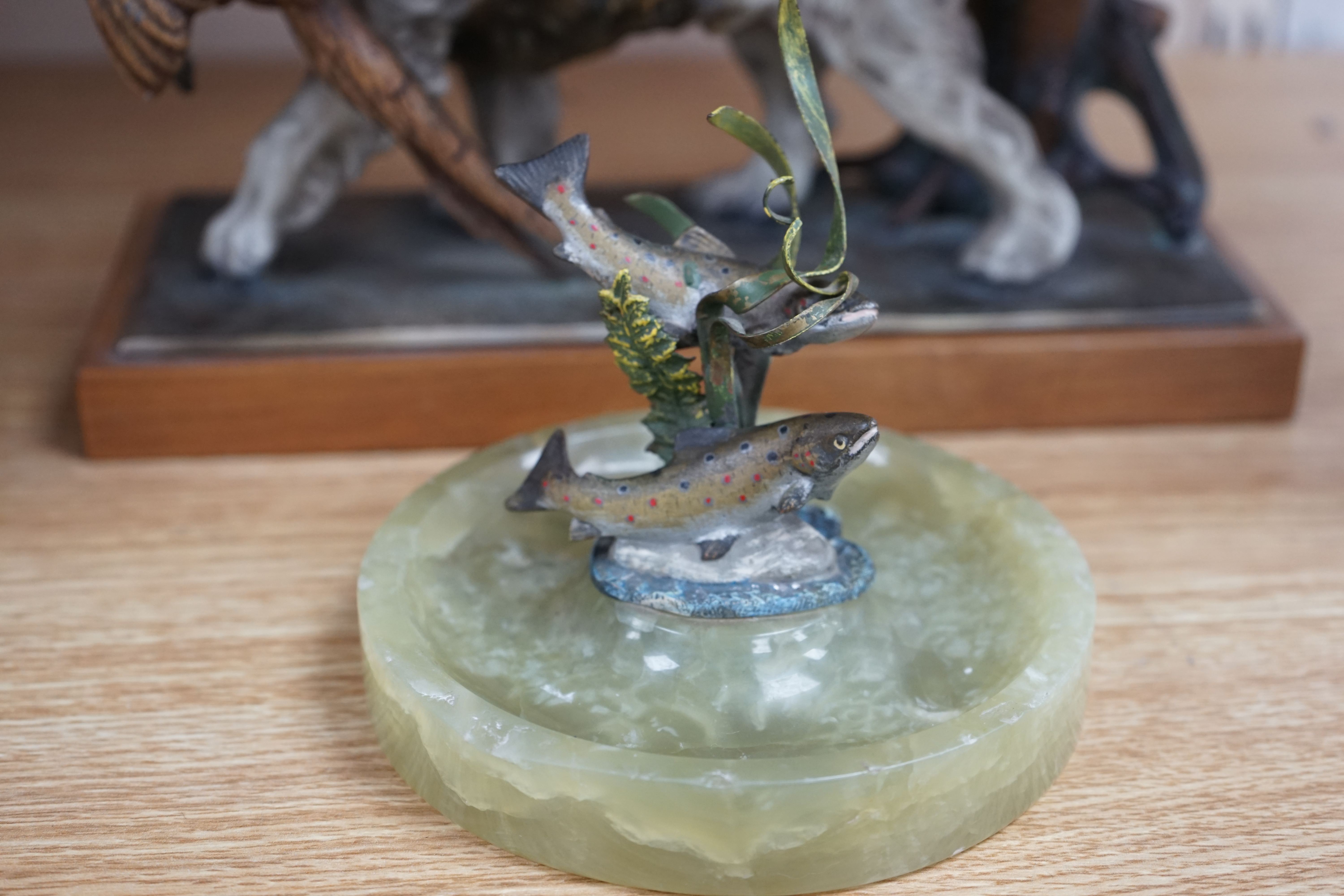 A cold painted bronze and onyx ‘rainbow trout’ ashtray and a painted spelter ‘hunting dog’ table lighter, 27cm. Condition - fair to good